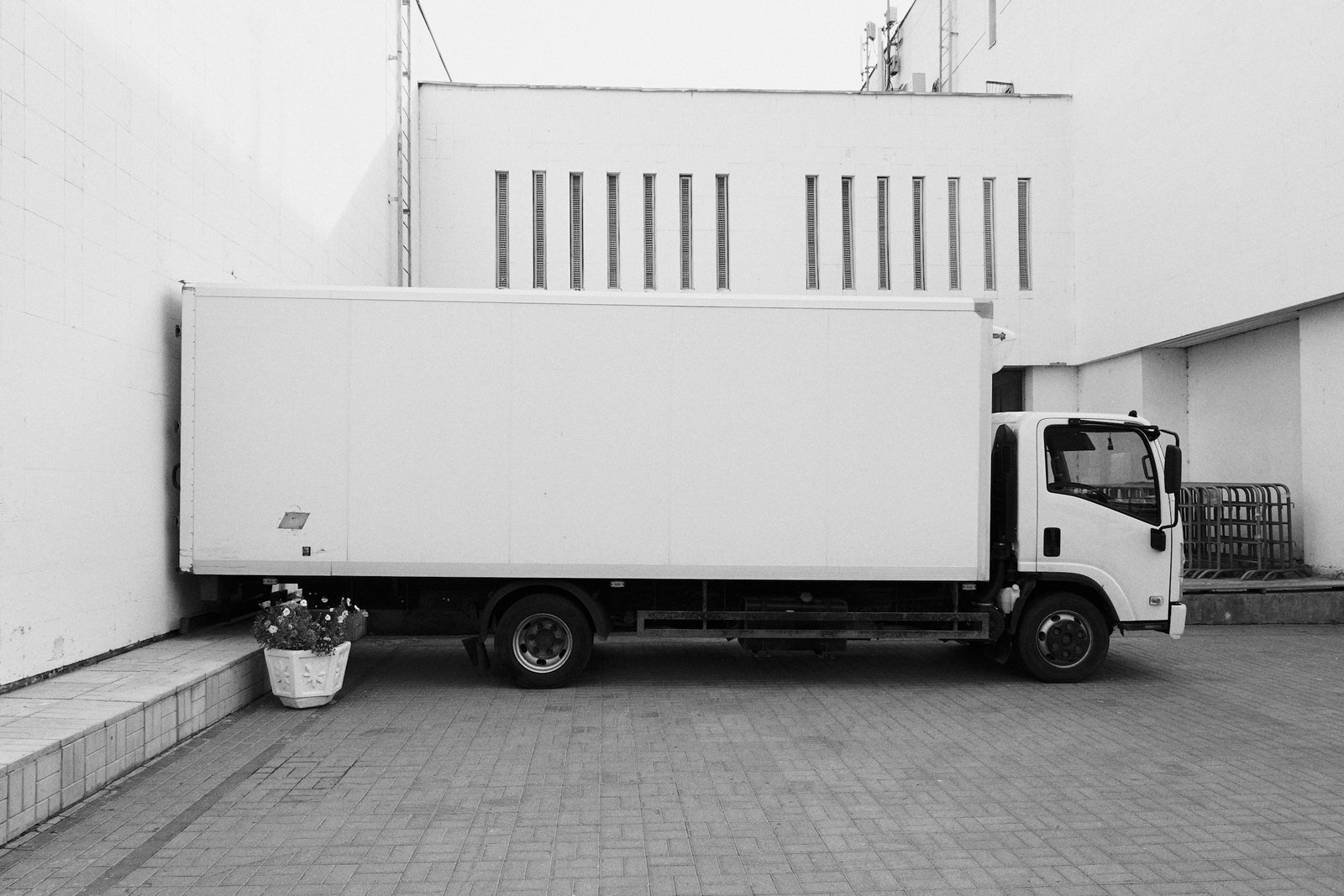 Box delivery truck representing breeder and wholesale order transportation